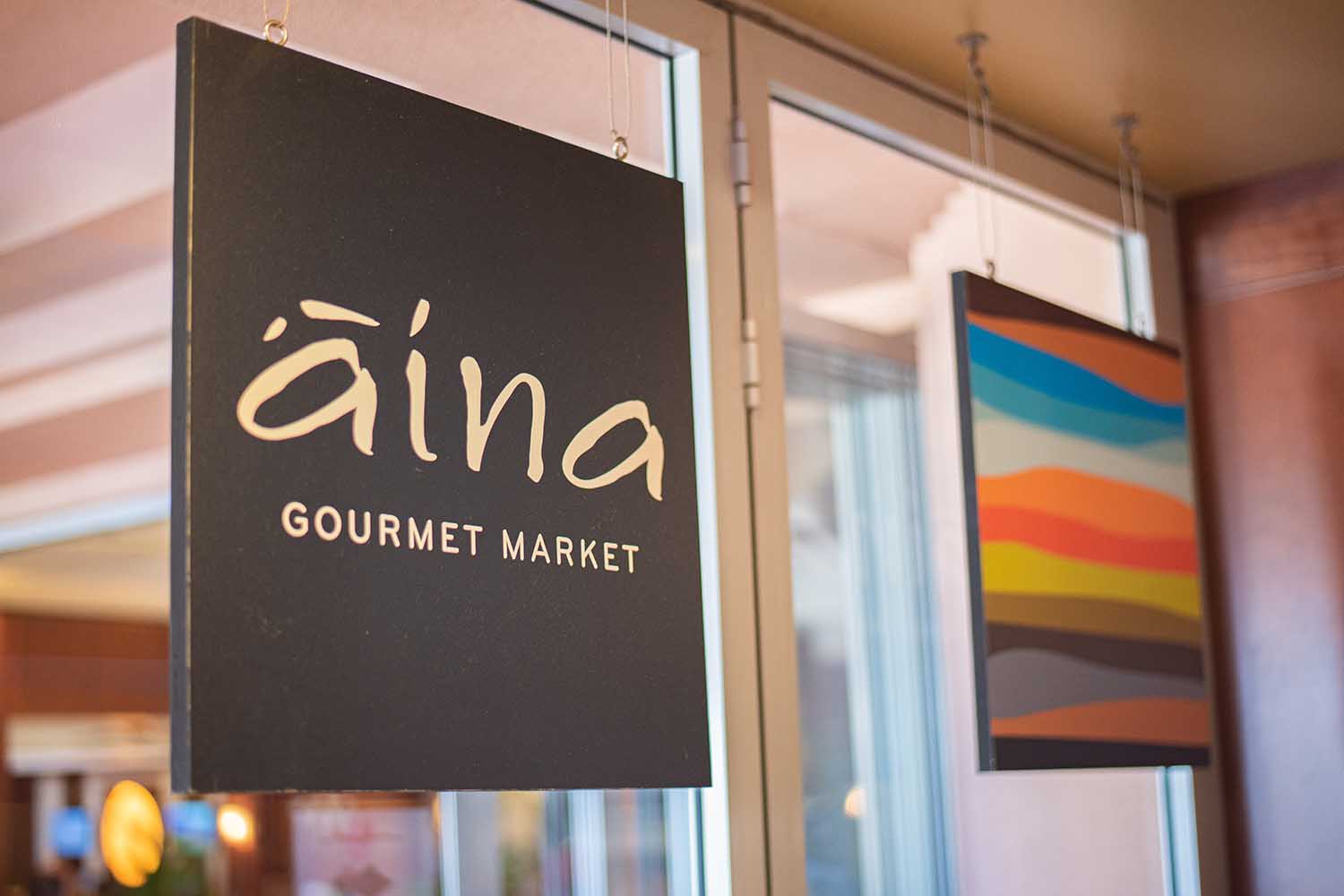 Aina Gourmet Market Logo Sign
